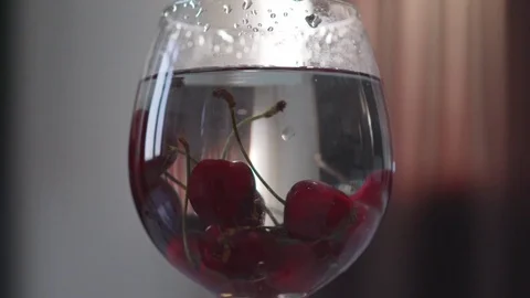 Cherries in a glass with wate 库存影片 76436908