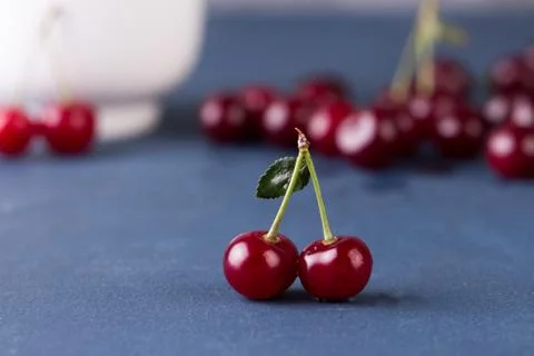 Cherries on grey stone background 写真素材