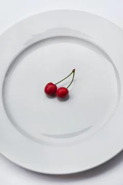 Cherries on a plate Stock Photos
