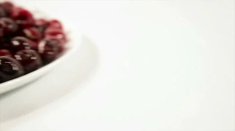 Cherries on the plate. on a white background Stock Footage 61218449