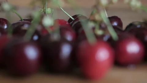 Cherries on rustic table Stock Footage 138194571