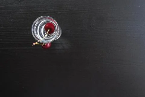 Cherries in a stack of water on a dark background Stock Photos