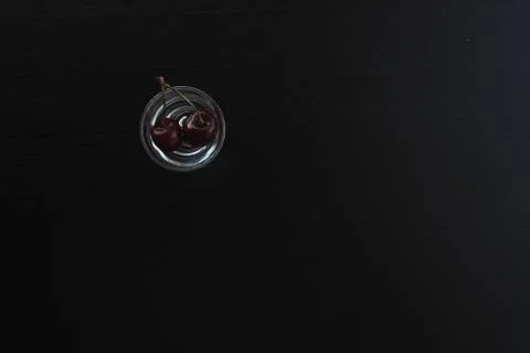 Cherries in a stack of water on a dark background Stock Photos