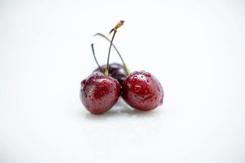 Cherries on a white background. Close-up, selective focus. Stock Photos