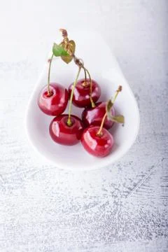 Cherries in a white dish Stock Photos