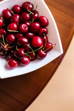 Cherries in a white square plate Фото