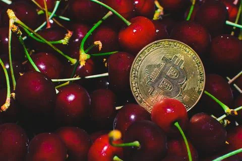 Cherry and bitcoin Stock Photos