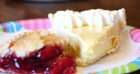 Cherry and Key lime pie dessert on plate close up ready to be eaten Stock Footage 151812066
