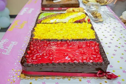 Cherry and mango fruit birthday cake Stock Photos
