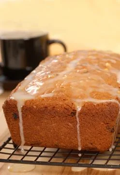 Cherry and raisin bread with lemon icing Stock Photos