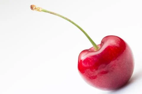 A cherry and stem on a white background Stock Photos