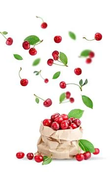 Cherry berries levitating on a white background. Isolated object on a white Stock Photos