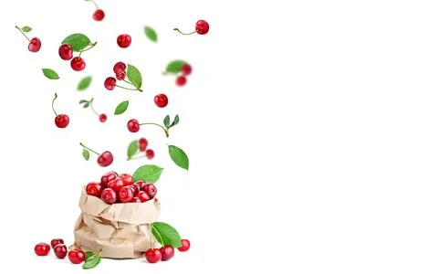 Cherry berries levitating on a white background. Isolated object on a white b Foto stock