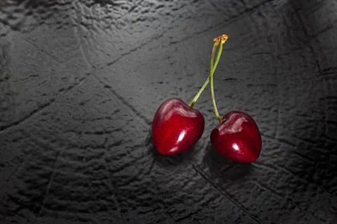 Cherry berries pair on dark background Foto stock