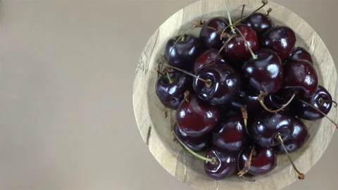 Cherry berries on a plate rotate in 4K Stock Footage 148097189
