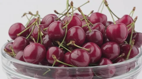 Cherry berries on a white background rotates Stock Footage 136101996