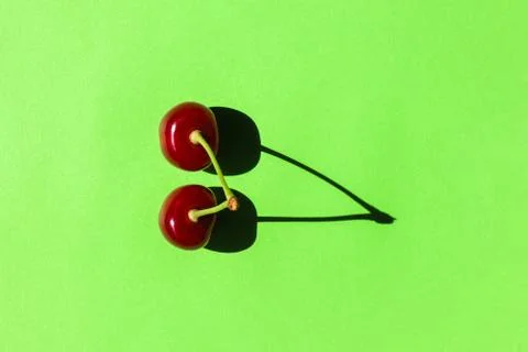 Cherry berry with a hard shadow on a plain background. the view from the top 스톡 사진