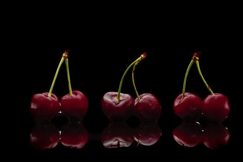 Cherry on black background Stock Photos
