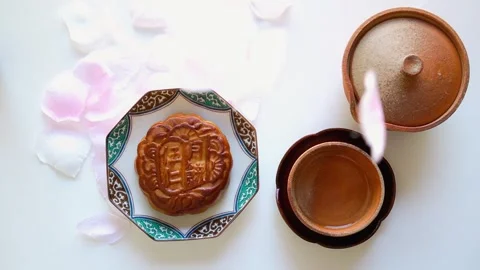 Cherry blossom petals drifting down Chinese  sweet Mixed nuts mooncake Stock Footage 320326010