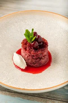 Cherry bread kadayif (ekmek kadayifi) with buffalo clotted cream on wooden .. Stock Photos