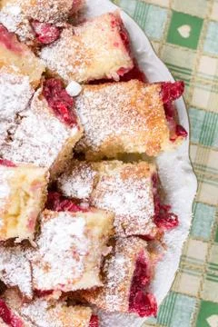 Cherry cake with powdered sugar on the plate Stock Photos