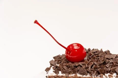 Cherry on the cake white background Stock Photos