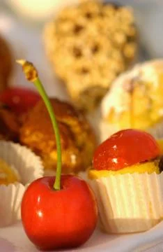 Cherry with cakes Stock Photos