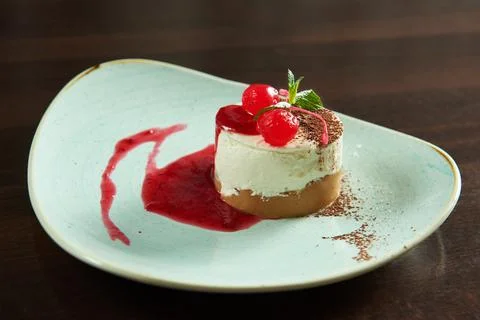 Cherry cheesecake served at the cafe Stock Photos