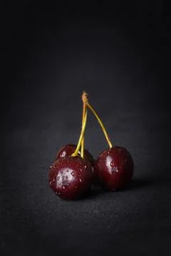 Cherry, Cherries on a black background Stock Photos
