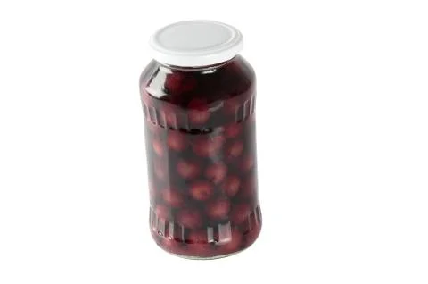 Cherry compote in a glass jar Stock Photos