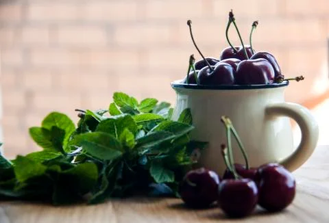 Cherry in cup Stock Photos