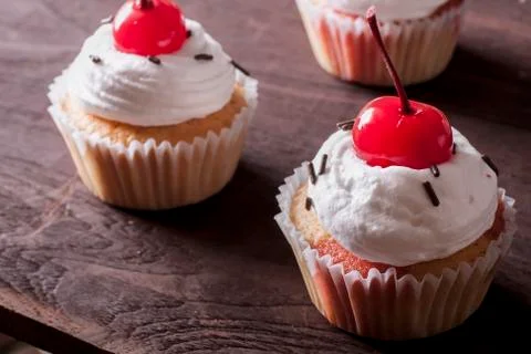 Cherry cupcakes Stock Photos