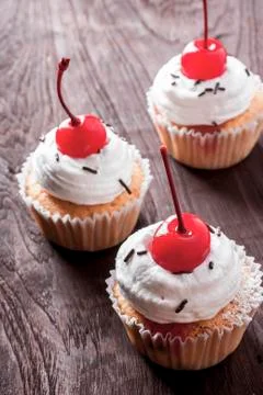 Cherry cupcakes Stock Photos