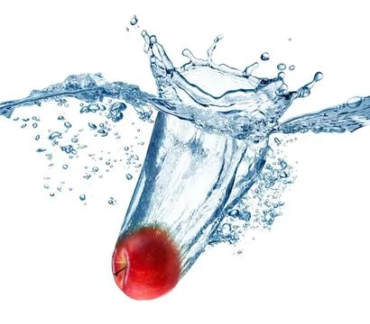 Cherry falling into a glass of water with splash effect Stock Photos