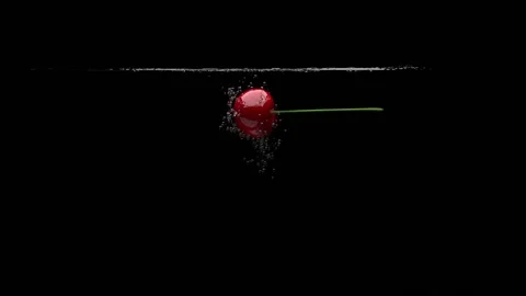 The cherry falls into the clear water. Black background. 3D-render. Stock-Footage 149681525