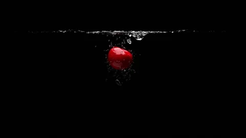 The cherry falls into the clear water. Black background. 3D-render. Stock-Footage 149681607