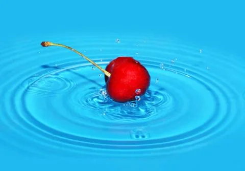 Cherry falls in  water Stock Photos