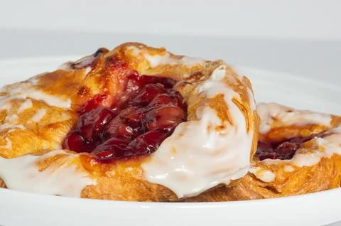 Cherry filled danish on white background Stock Photos