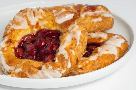 Cherry filled danish on white background Stock Photos