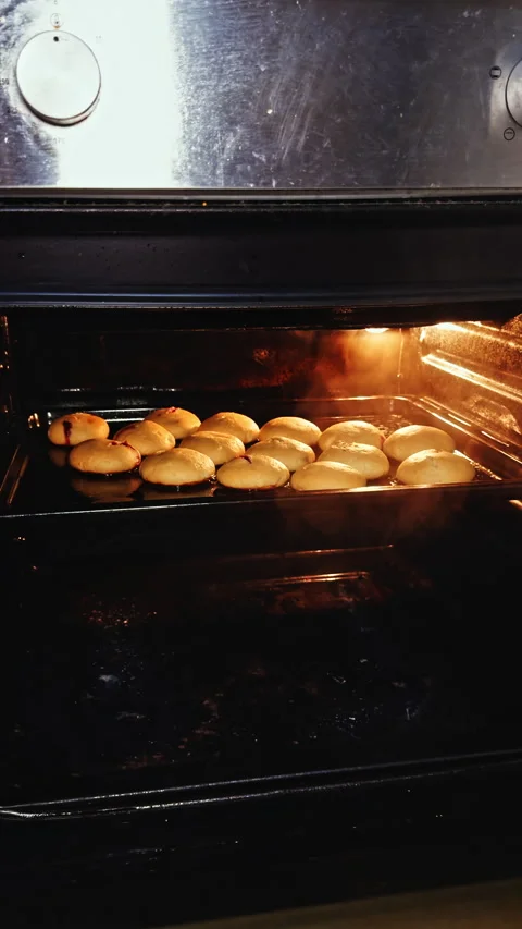 Cherry-Filled Pastries Baking in Oven Stock Footage 277735097
