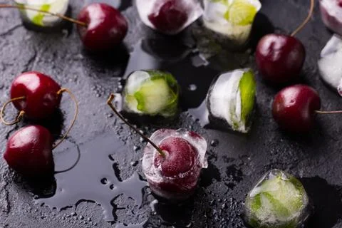 Cherry frozen in ice cube 写真素材