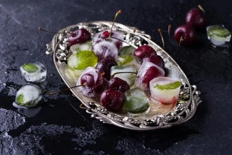 Cherry frozen in ice cube 写真素材