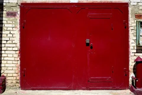 Cherry garage doors with security lock from breaking.	 Stock Photos