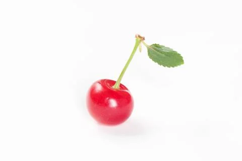 Cherry with green leaf on white background Foto stock