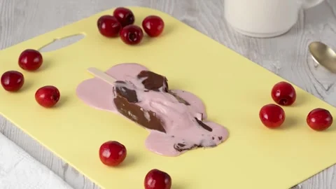 Cherry ice cream covered in chocolate melts. Stop motion animation. Stock Footage 339236561