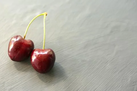 Cherry isolated. Cherries on dark. Stock Photos