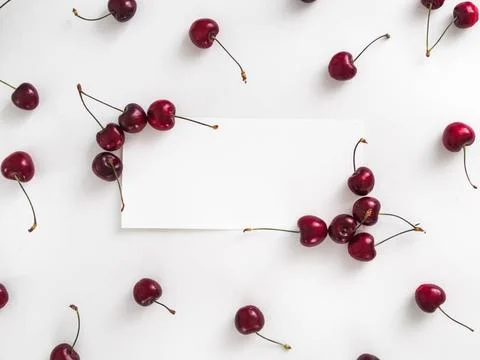 Cherry isolated on white with white rectangle Creative layout with fresh r... Stock Photos
