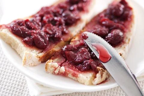 Cherry jam on toast Stock Photos