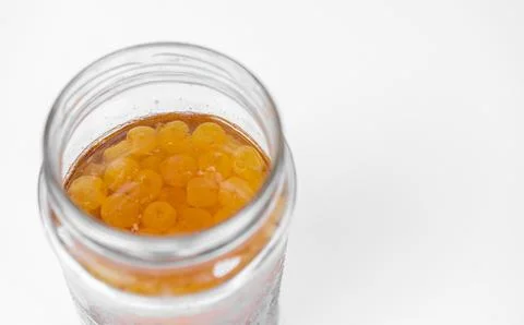 Cherry jam on a white background Stock Photos