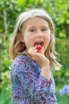 Cherry in the mouth Stock Photos